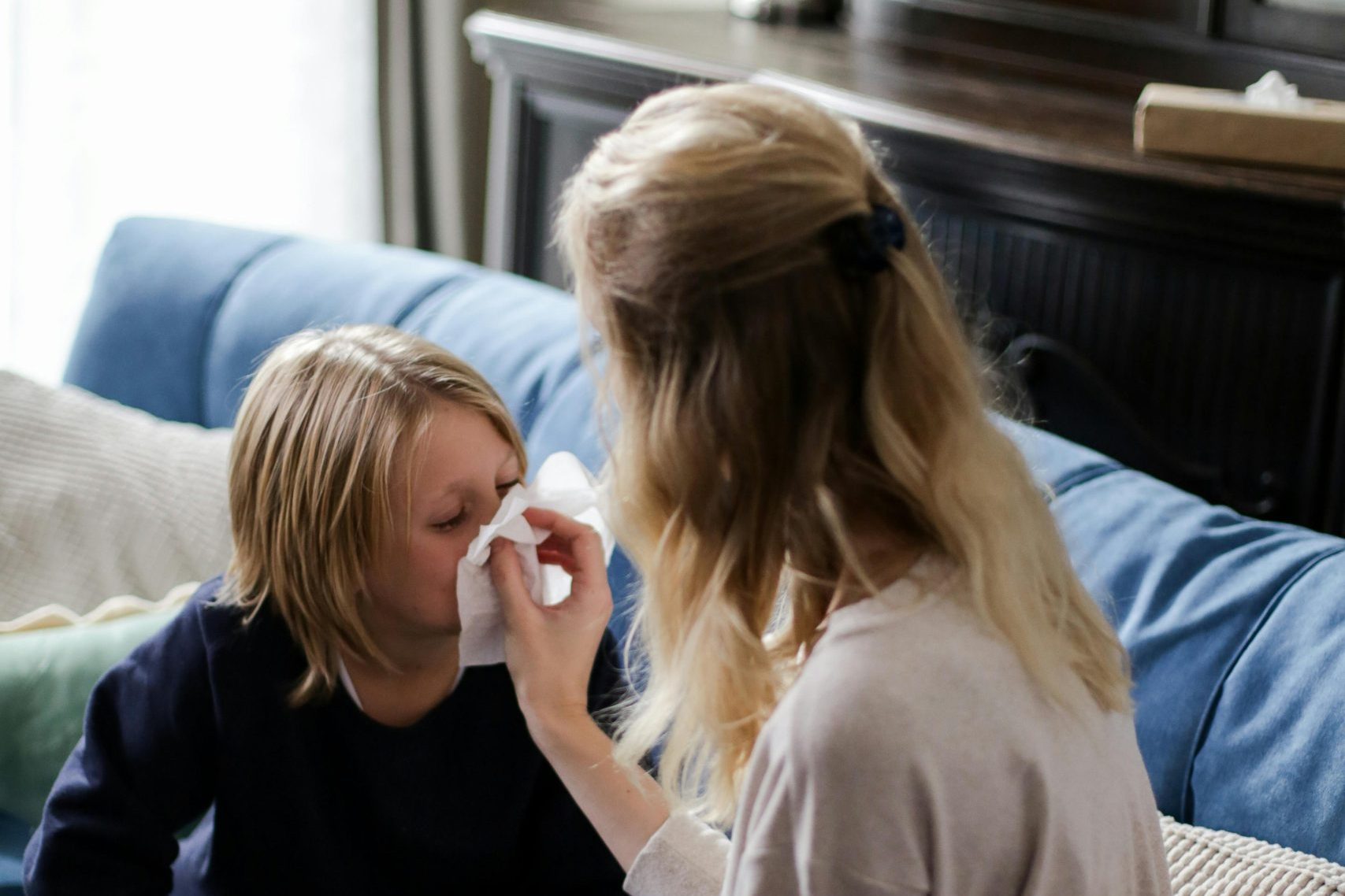 a mother taking care of a sick child